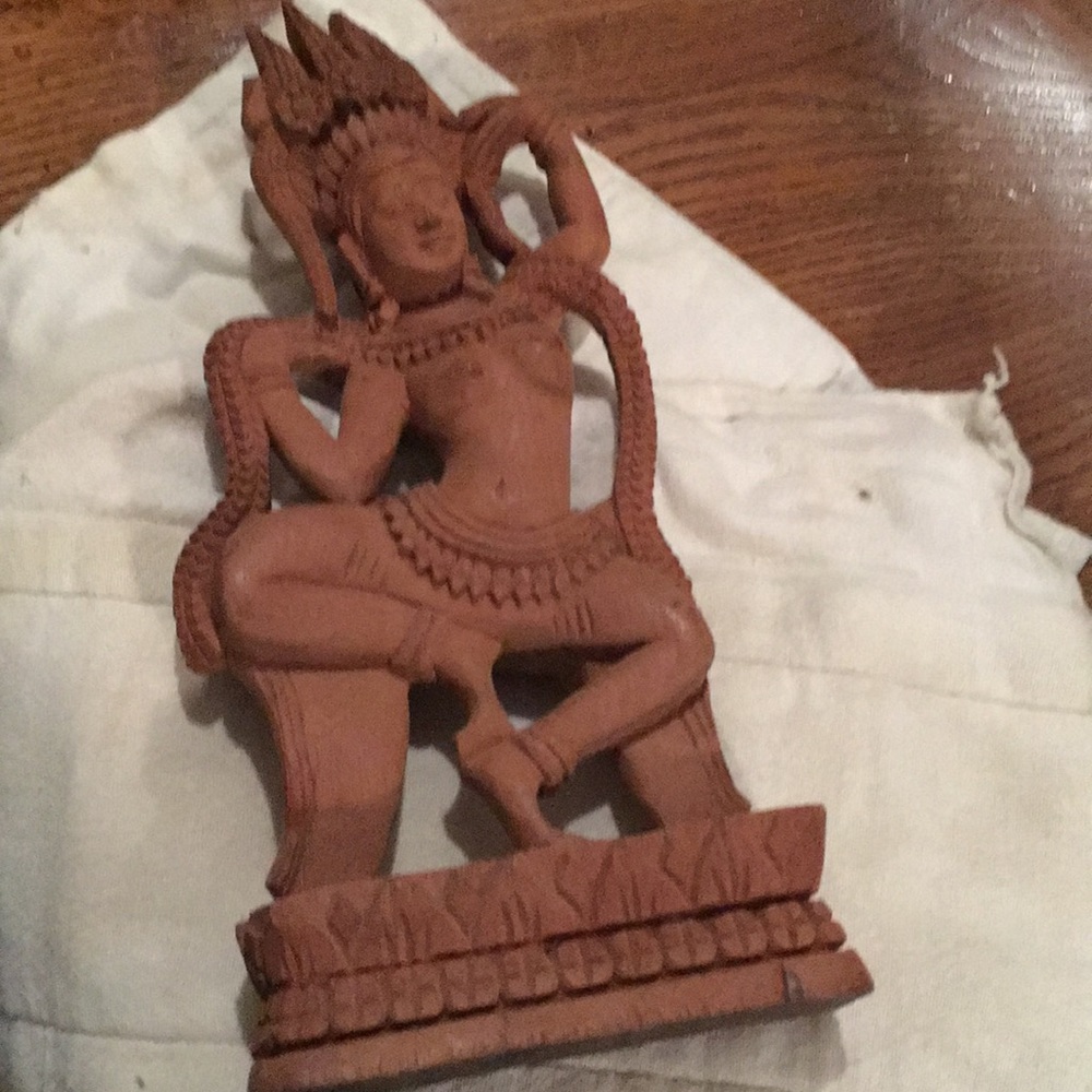Old hand carved Buddhist Wooden statuette